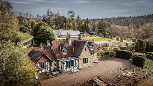 An aerial view of Cragside Park Cottage and the estate's formal gardens, Northumberland